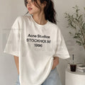 Acne Studios Stockholm 1996 Graphic T-Shirt – Minimalist Distressed Off-White Tee